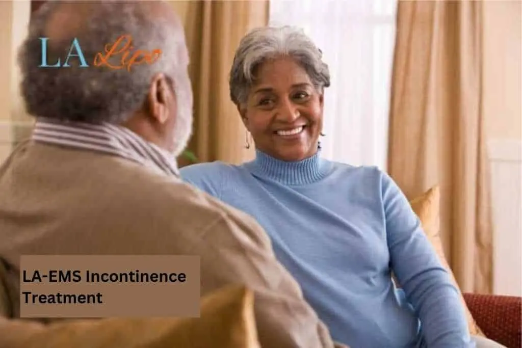 Couple sat smiling at each other - LA-EMS treatment Colchester