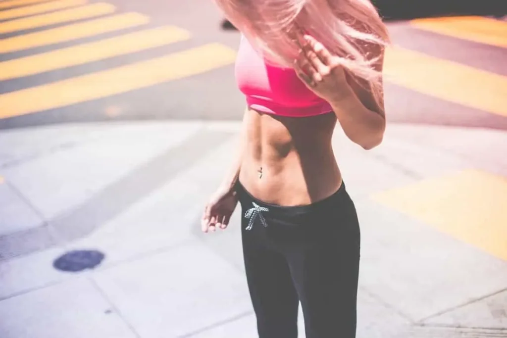 Woman with toned stomach after LA-EMS Body Sculpting Treatment Colchester 